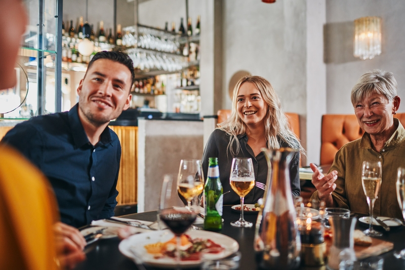 Friends and family enjoying dinner at a restaurant