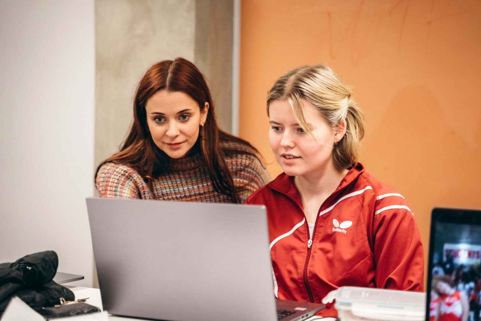 Two women working in front of a computer