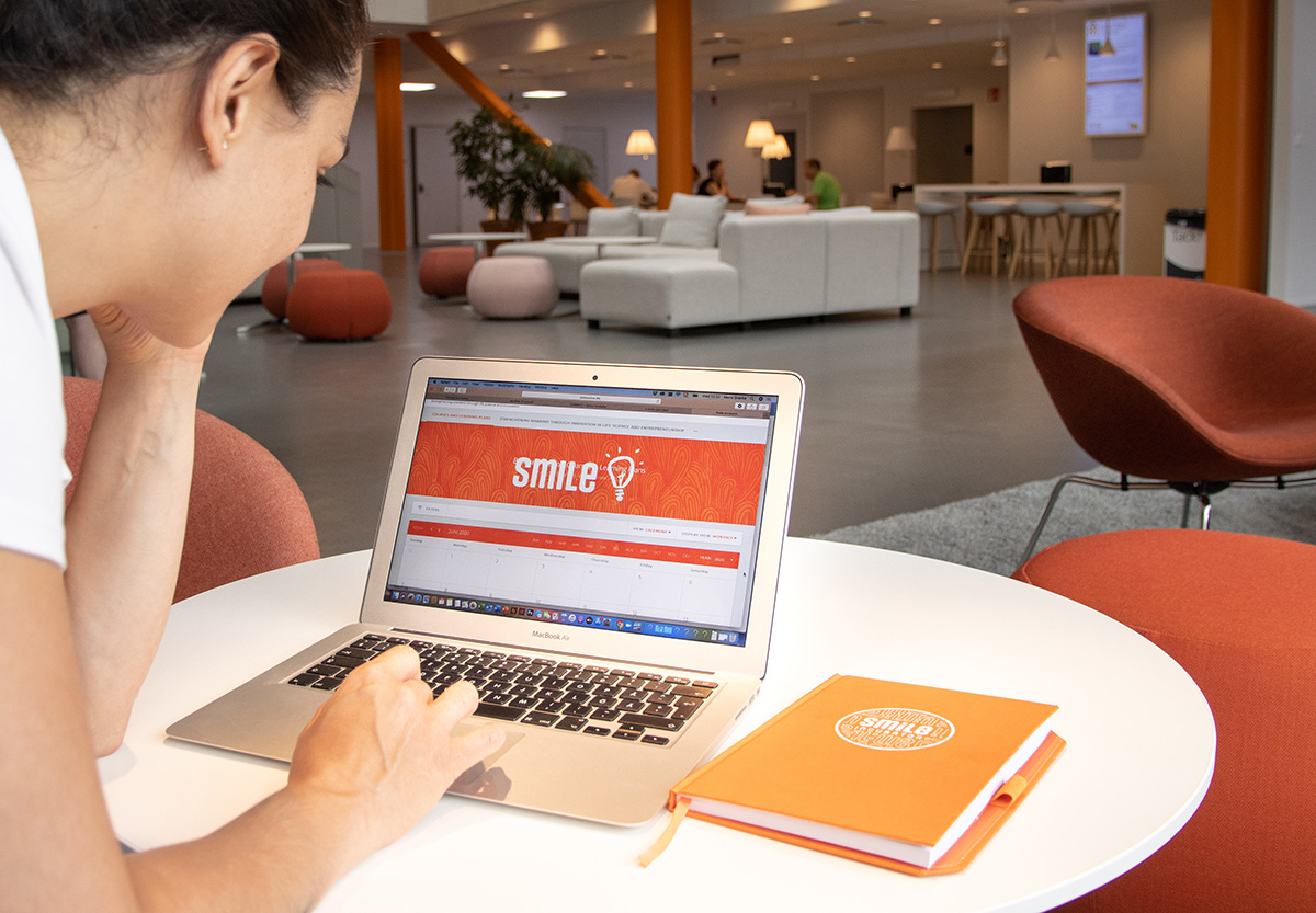 Woman working at a laptop in an office environment